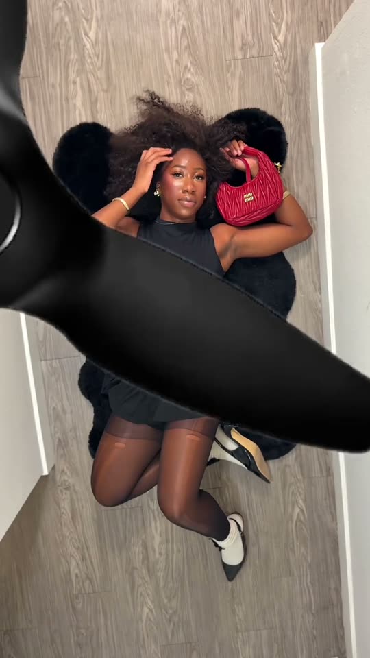 Fan transition into a black dress