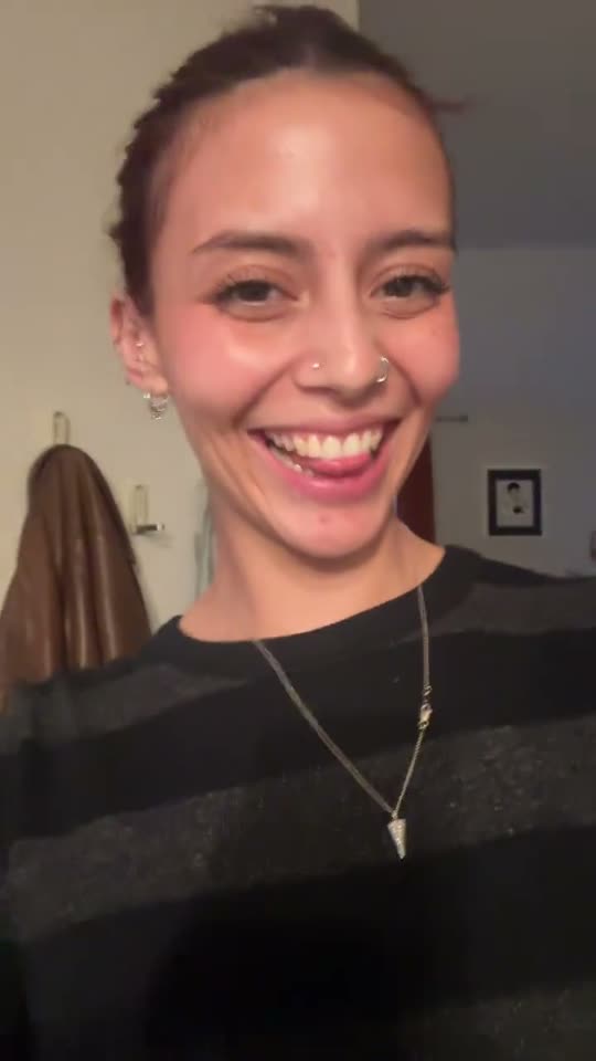 Smiling woman with piercings