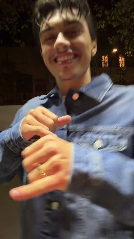Man dancing in denim jacket