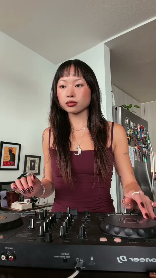 DJ mixing music at home