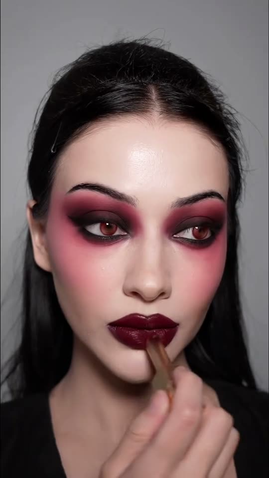 Applying dark gothic makeup