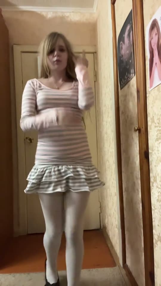 Woman in striped dress dancing