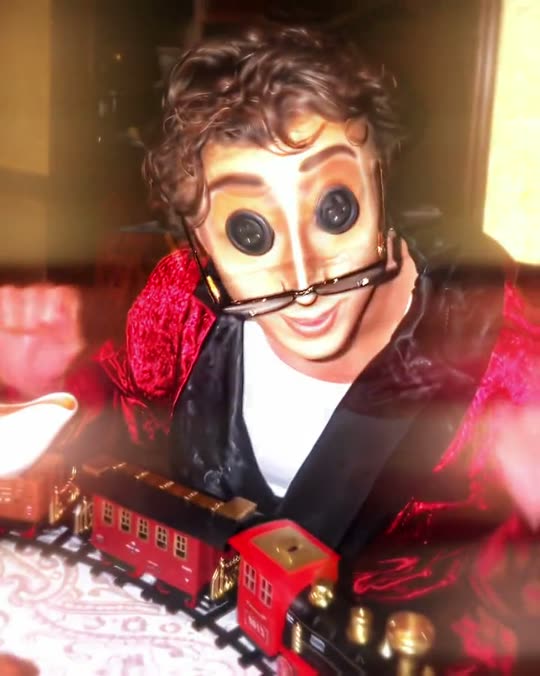 Button-eyed person with toy train