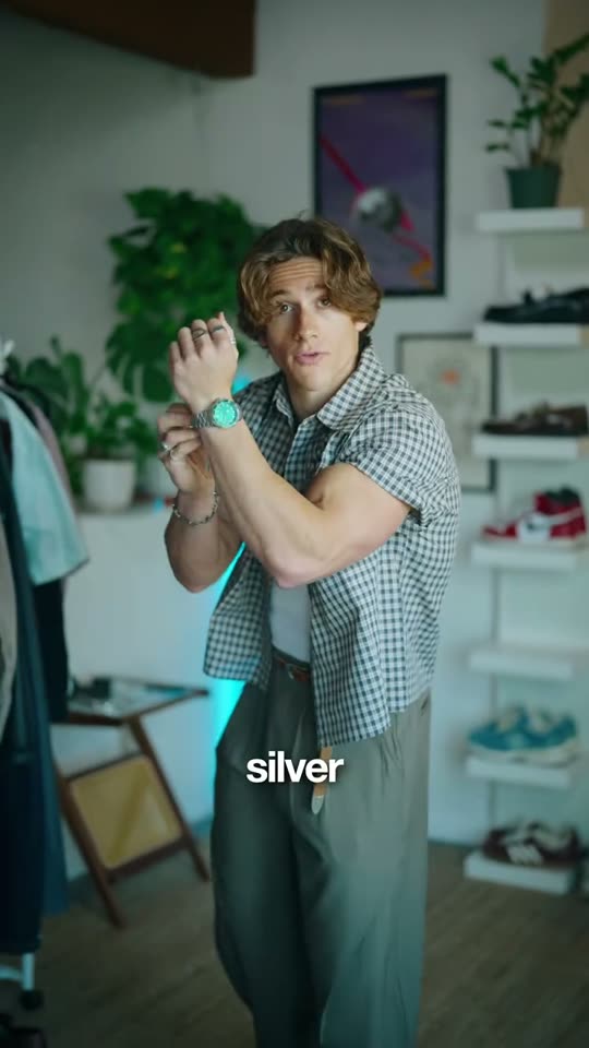 Man showing off silver accessories