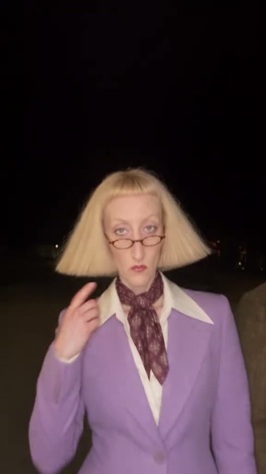 Woman in wig and glasses