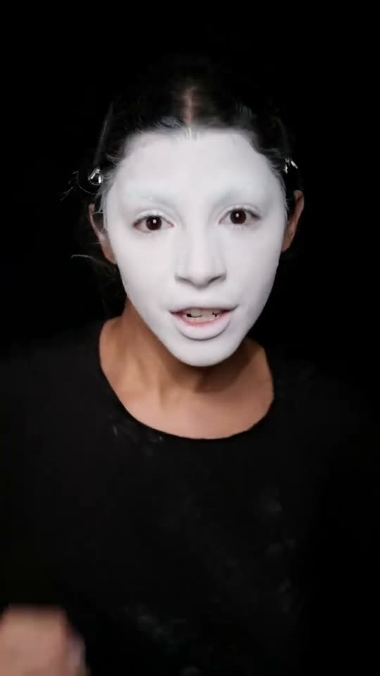 Applying white face makeup