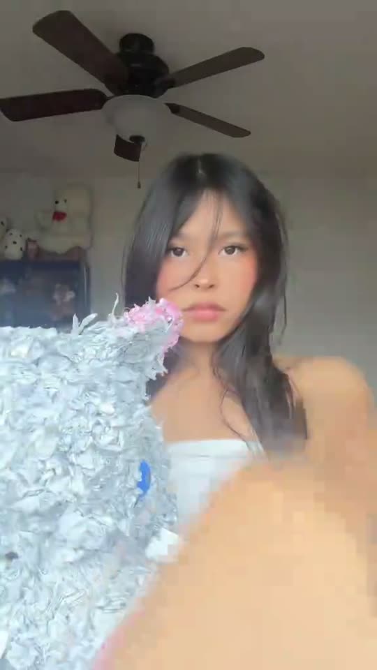 Girl holding a fluffy object