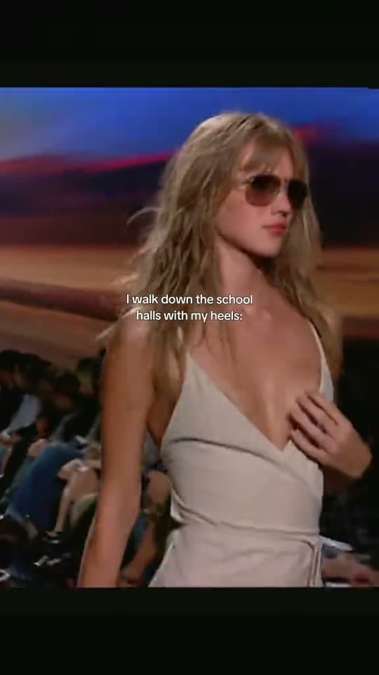 Woman runway walk in sunglasses