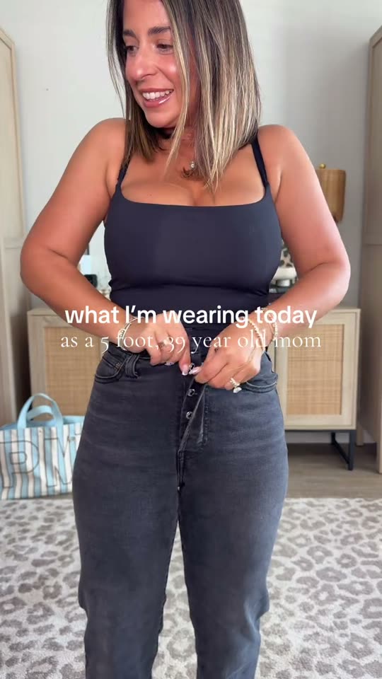 Woman trying on fall outfit