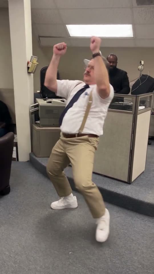 Man dancing in office