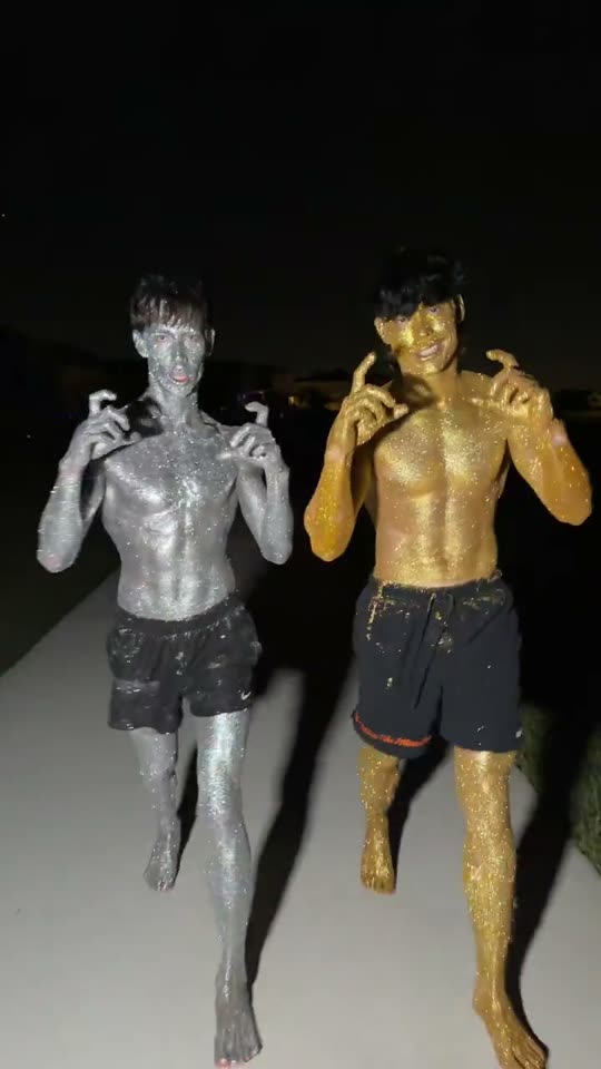 Two men covered in glitter