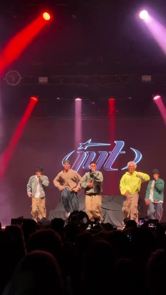 Boy band performs on stage
