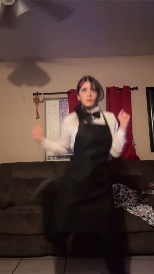 Anime cosplay dancing in apron