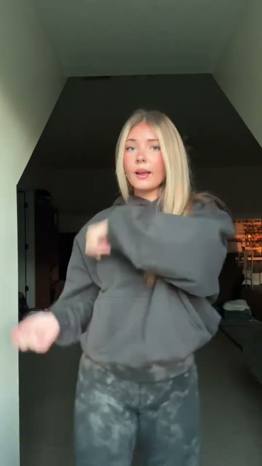 Girl dancing in hoodie