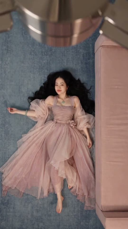 Fan transition into a pink dress