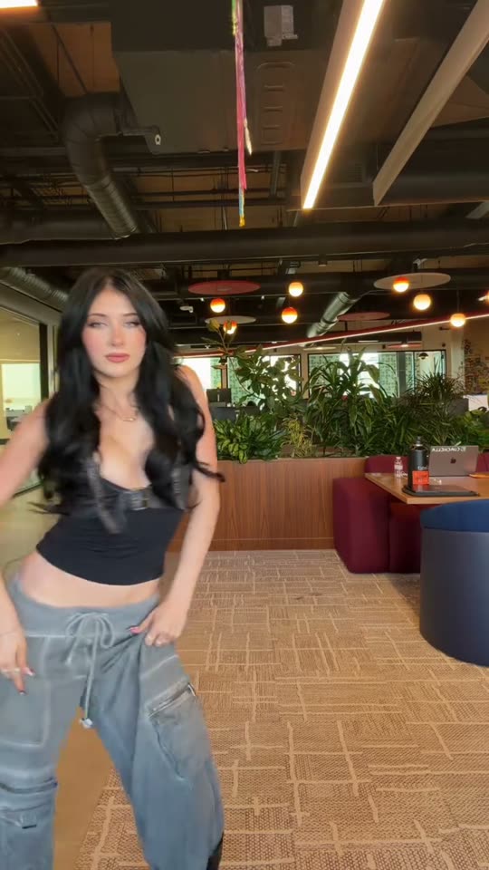 Woman dances in office