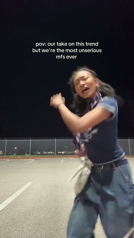 Woman dancing in a parking lot