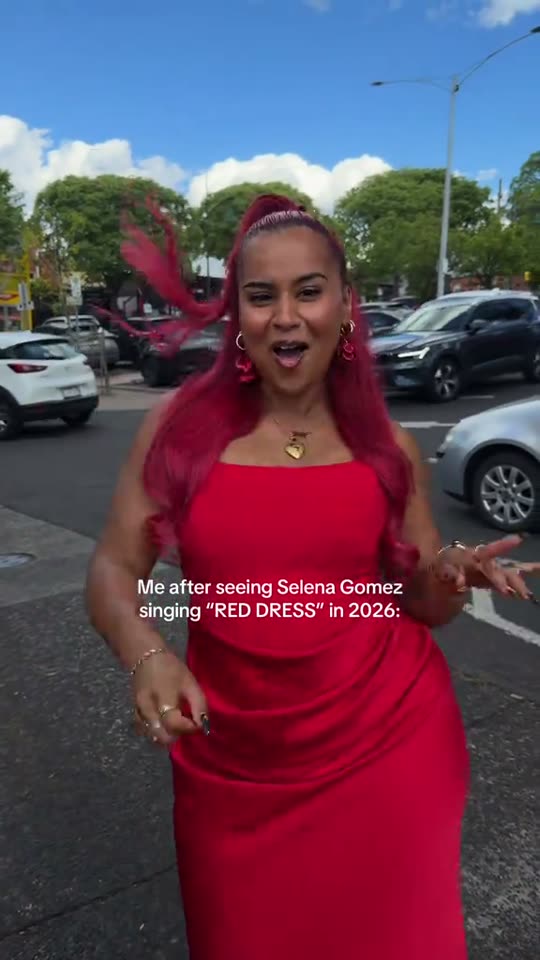 Woman dancing in red dress