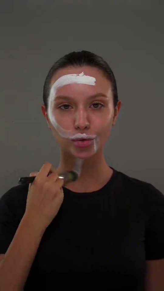 Applying white face paint