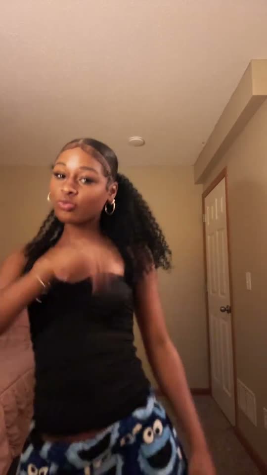 Woman dancing in bedroom