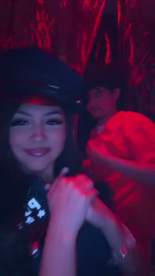 Couple in police and prisoner costumes