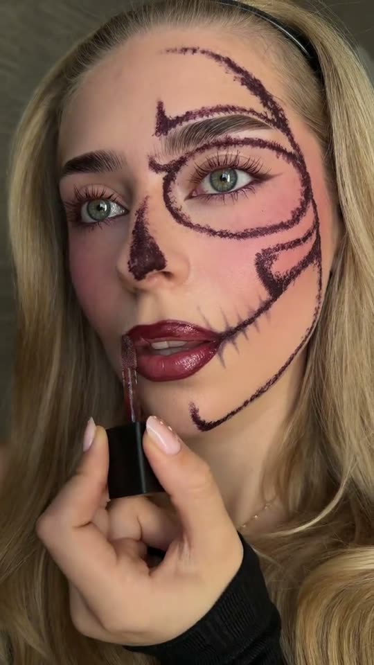 Applying Halloween skull makeup
