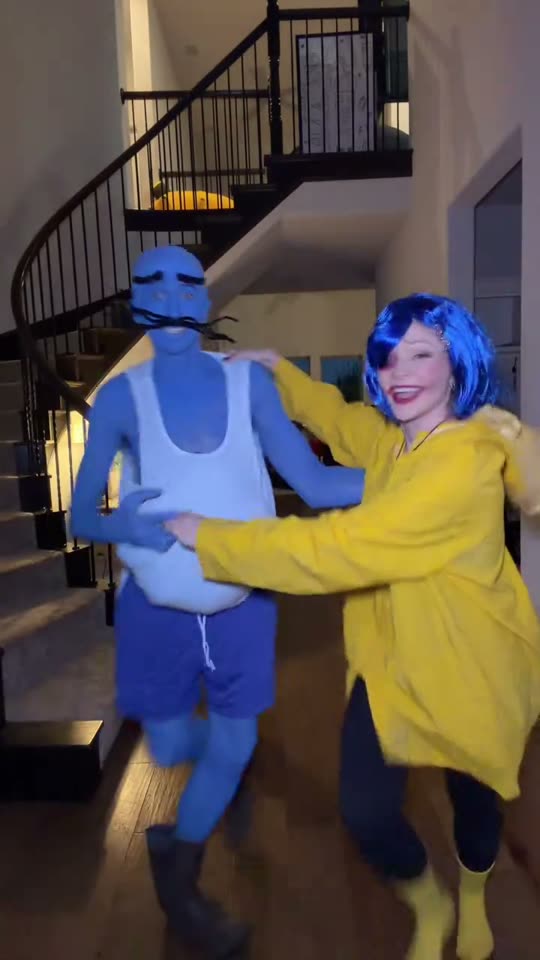 Couple in Coraline costumes