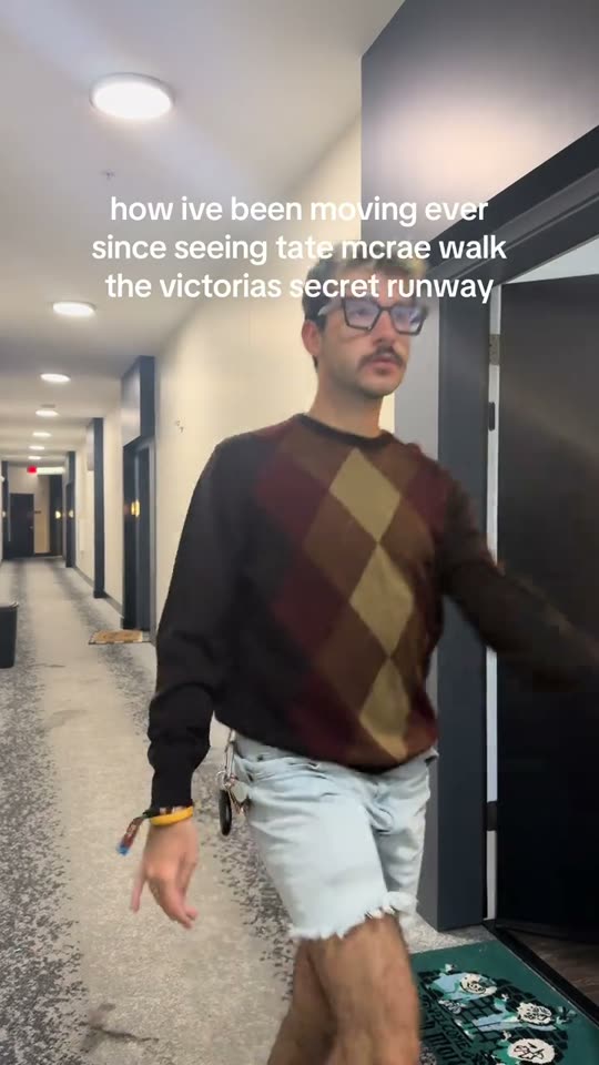 Man's runway walk in hallway