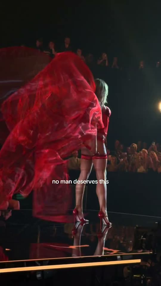 Singer performs in red outfit