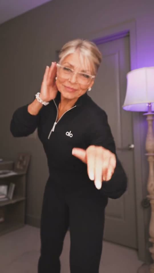 Woman dancing in black outfit