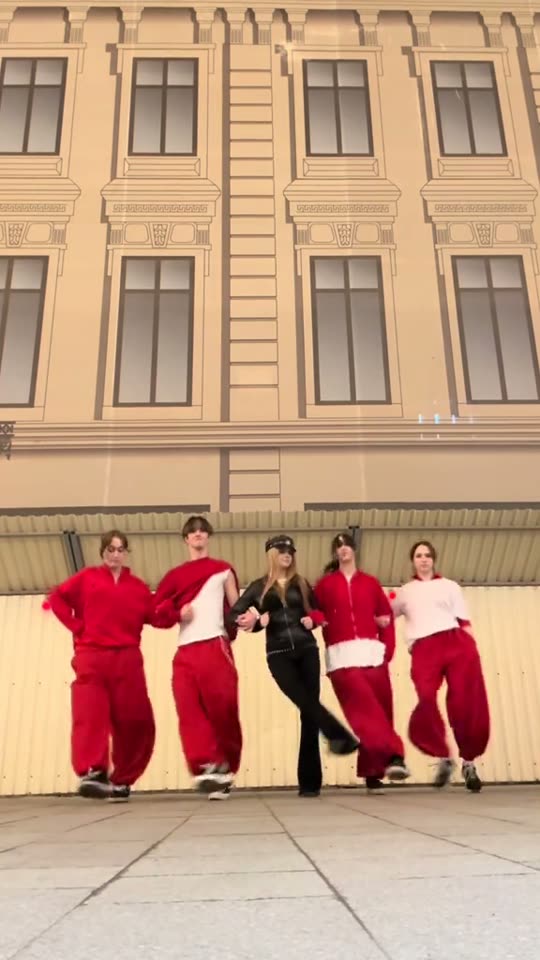 Five people doing a dance