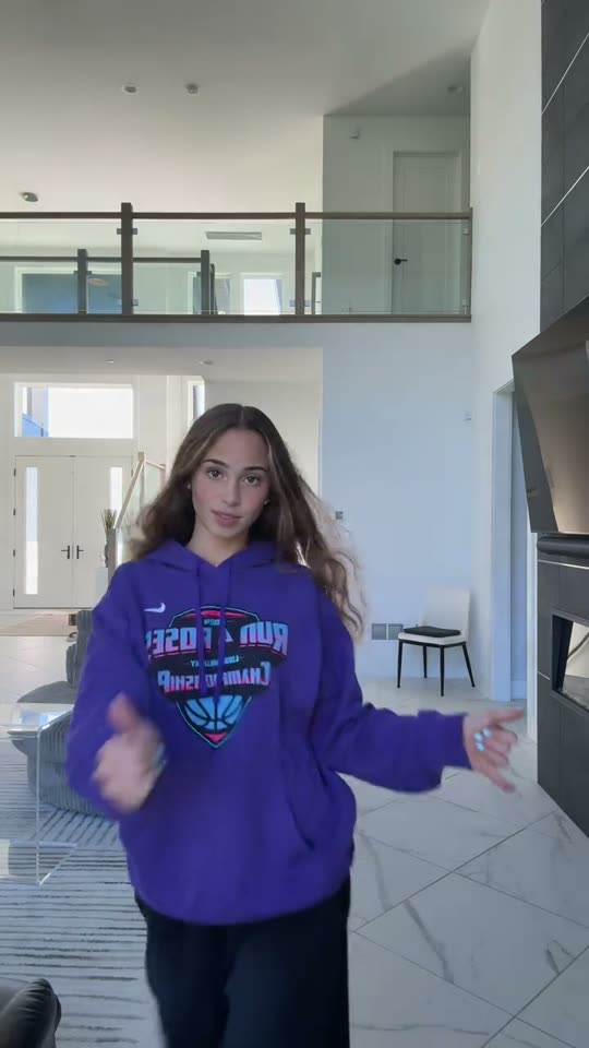 Girl dancing in a hoodie
