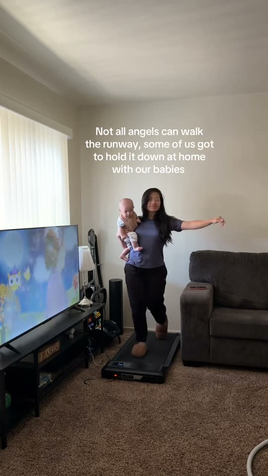 Mom walks with baby