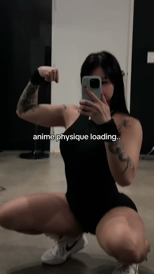 Flexing in a black bodysuit